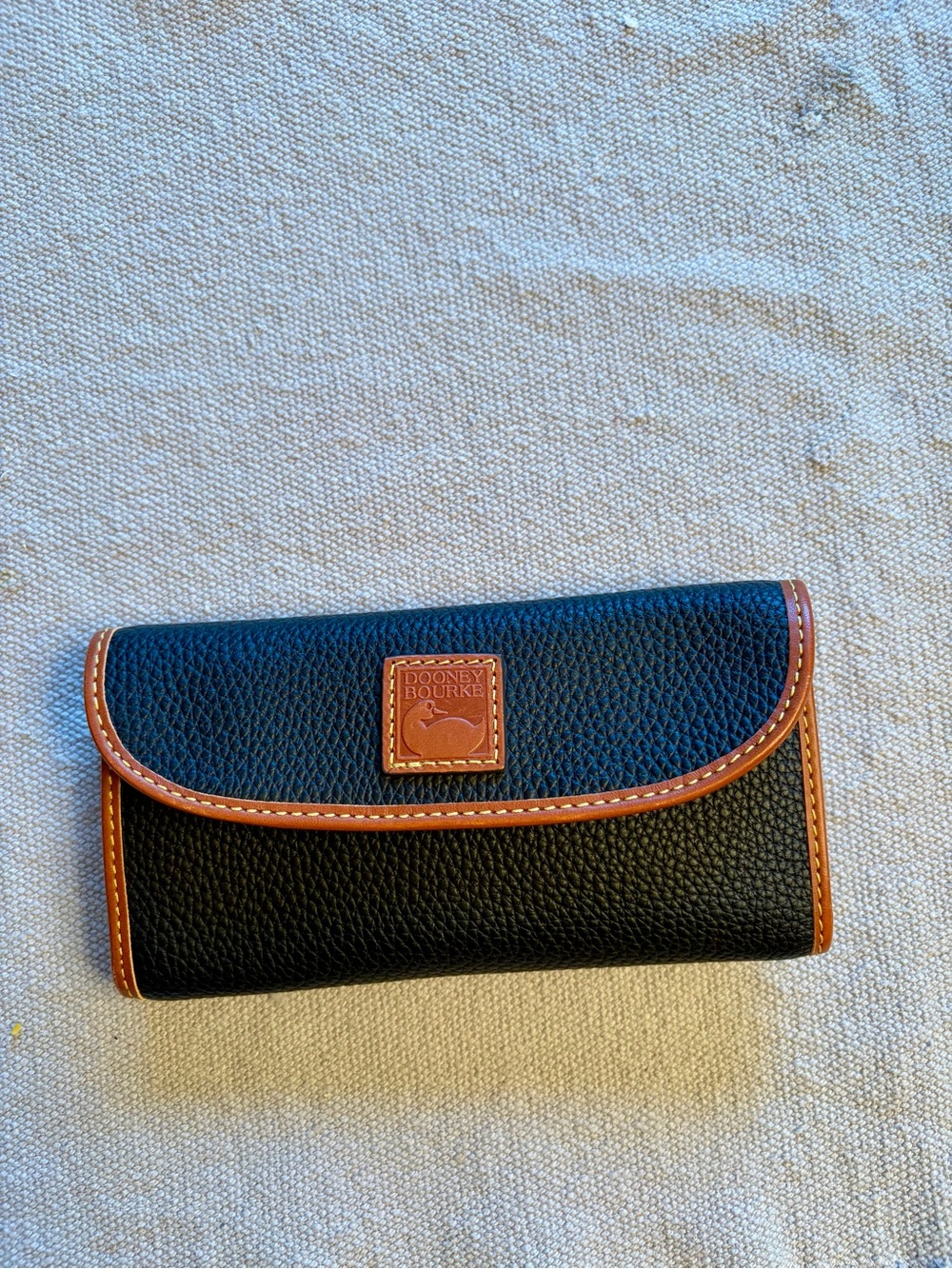 Dooney & Bourke Black Pebbled Leather Wallet with Brown Trim
